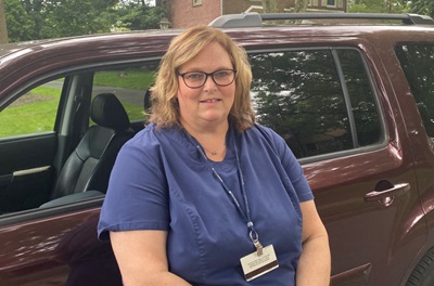 Donna Cartwright, BSN, by her car